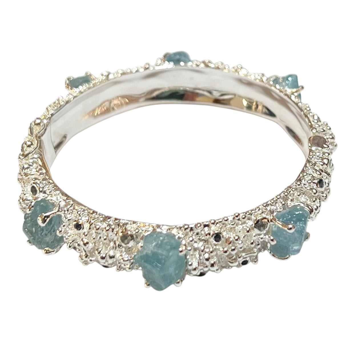 Bangle - Anemone with Lock Clasp. Sterling silver, featuring raw aquamarine, blue sapphire and blue topaz