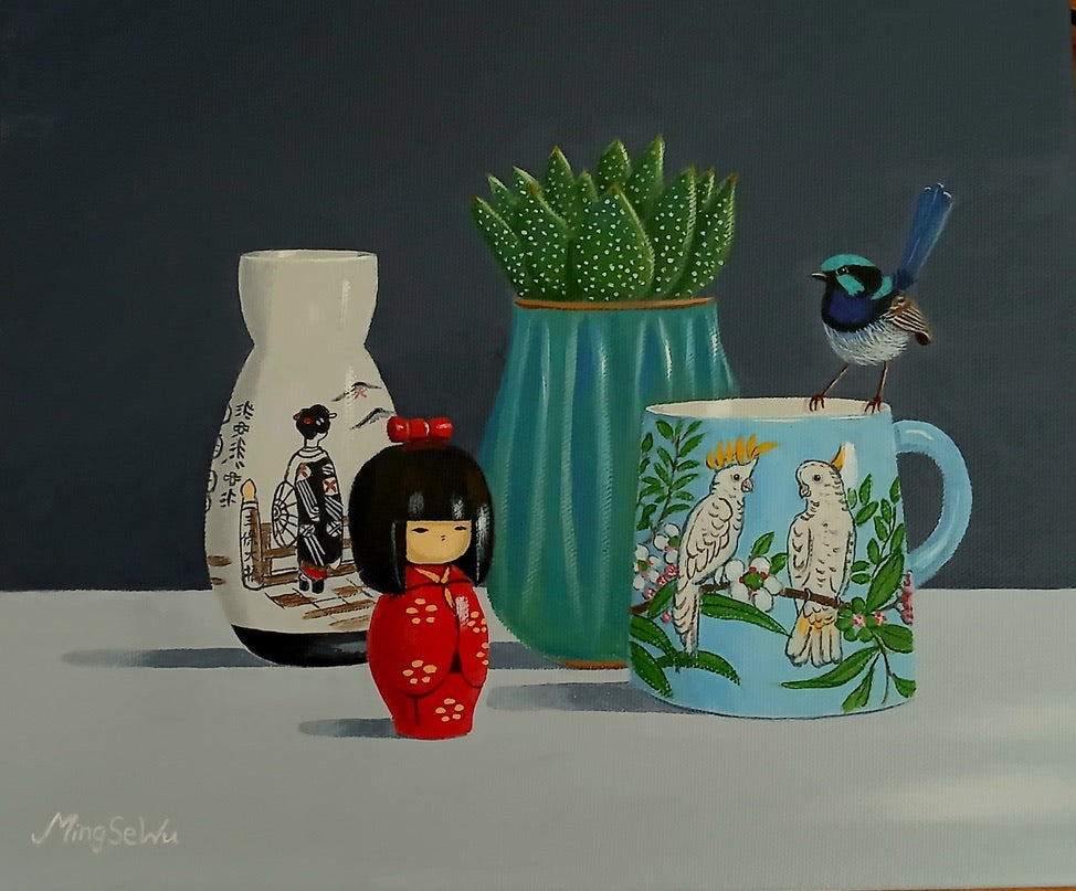 Doll, Cockatoo Mug and Succulent