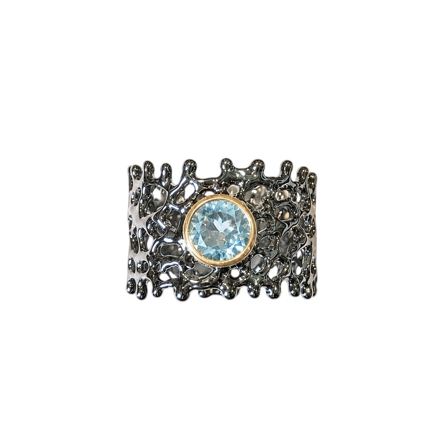 Ring - Fan of the Sea, Rhodium with Yellow Gold Accent around a Blue Topaz