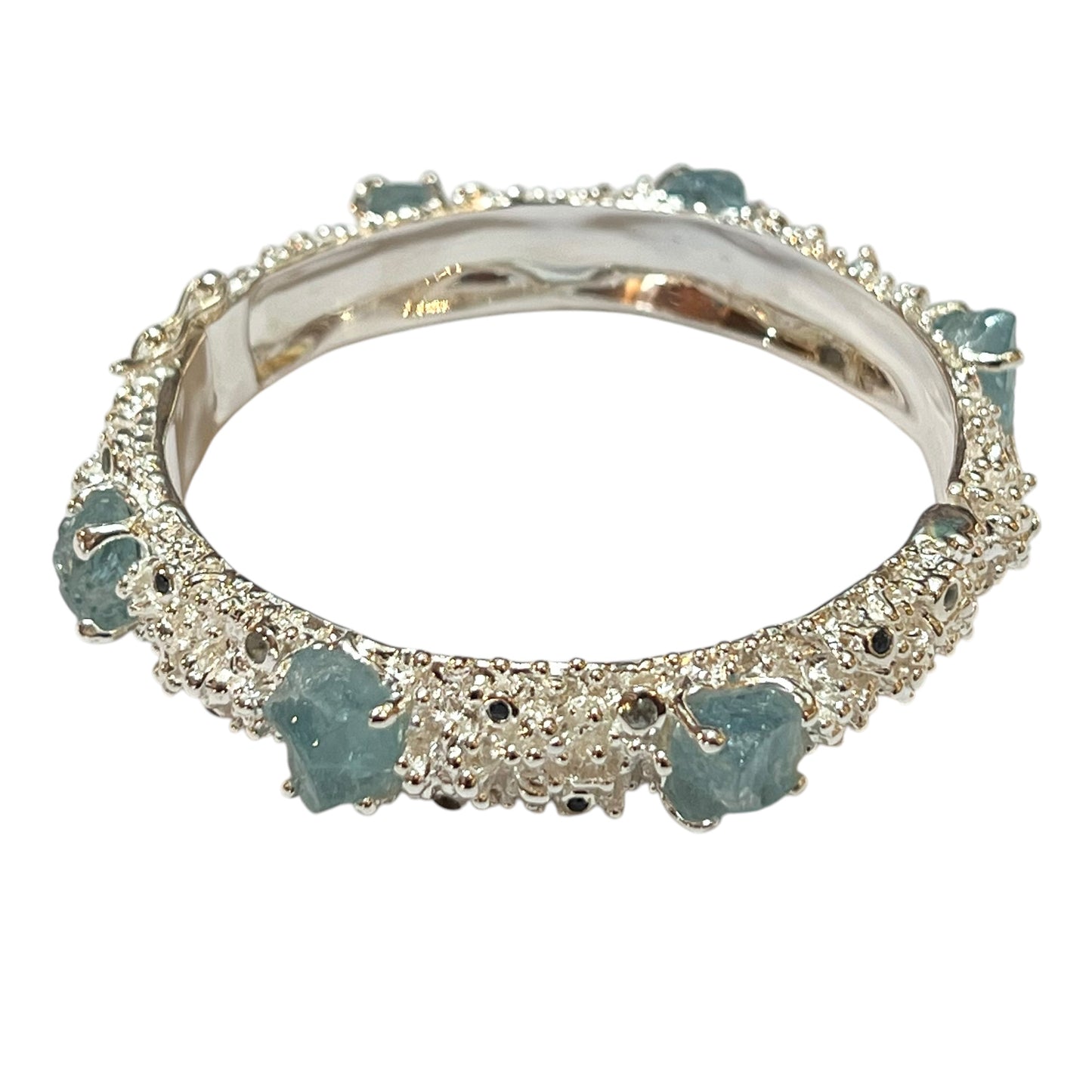 Bangle - Anemone with Lock Clasp. Sterling silver, featuring raw aquamarine, blue sapphire and blue topaz