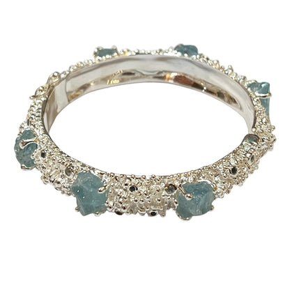 Bangle - Anemone with Lock Clasp. Sterling silver, featuring raw aquamarine, blue sapphire and blue topaz